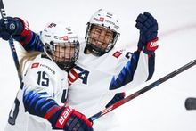 Savannah Harmon and Alex Carpenter (Team USA) hugging after a goal