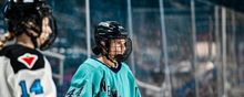 Jill Saulnier lining up for a face-off in her PWHL New York jersey