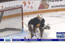 A screenshot of Emma Soderberg in nets on Fox 21 local news, ready to take a shot during hockey practice