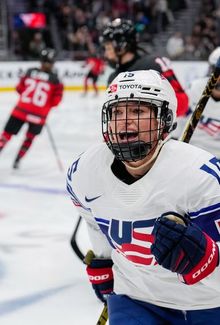 Savannah Harmon skating with her team (Team USA) and smiling