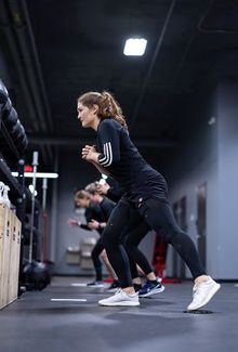 Nicole Hensley training in the gym with her teammates