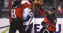 Jamie Lee Rattray celebrating a goal with her Team Canada teammate