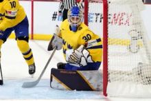 Emma Soderberg tracks a puck with Team Sweden