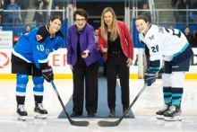 Billie Jean King and Jayna Hefford take part in the ceremonial puck drop with Toronto captain Blayre Turnbull of Toronto and New York counterpart Micah Zandee-Hart