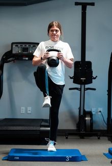Hannah Brandt working out with a kettlebell in the gym
