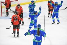 Kennedy Marchment celebrating a goal surrounded by her teammates