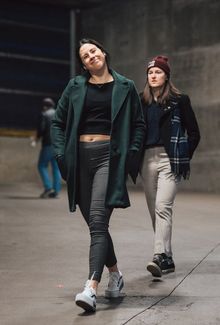 Kennedy Marchment smiling at the camera while walking into the arena with her teammate