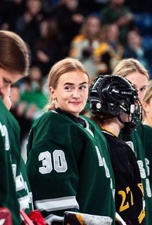 Emma Söderberg standing for the national anthem with her PWHL Boston teammates