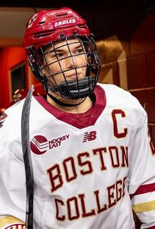 Abby Newhook in a Boston College jersey walking through the hallway.