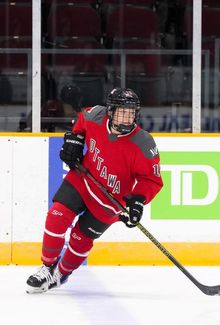 Savannah Harmon (PWHL Ottawa) skating along the blue line and watching the play