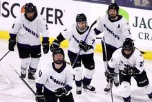 Players from PWHL Minnesota celebrating a goal