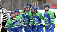 The Whale's Kennedy Marchment celebrating scoring a goal with her teammates