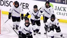 Players from PWHL Minnesota celebrating a goal
