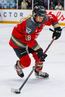 Mannon McMahon skating with focus on the puck.