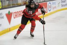 Jamie Bourbonnais (Team Canada) passing the puck